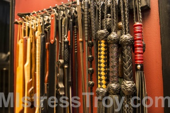 MISTRESS TROY Pro-Domme Manhattan NYC New York uses implements for spanking and corporal punishment on male slaves,
            submissives, masochists and fetishists in Her dungeon